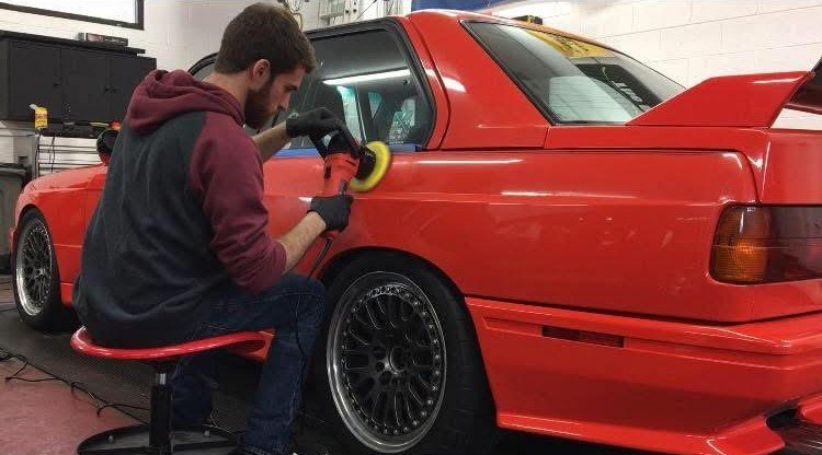 company owner polishing a vehicle